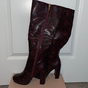 Snake print heeled boots